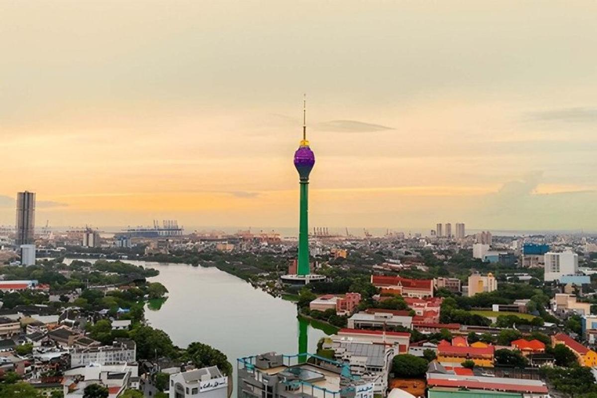 a view of a city with a river and a tower