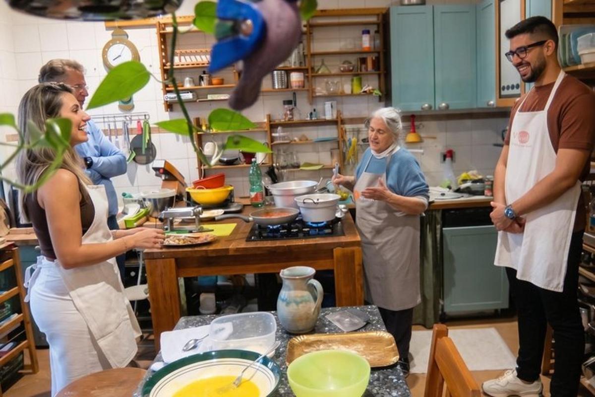 a group of people standing in a kitchen