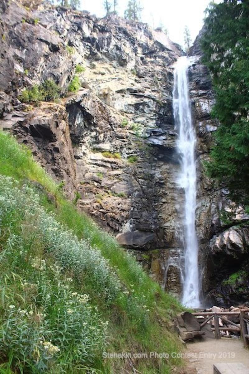 a waterfall on the side of a rocky mountain