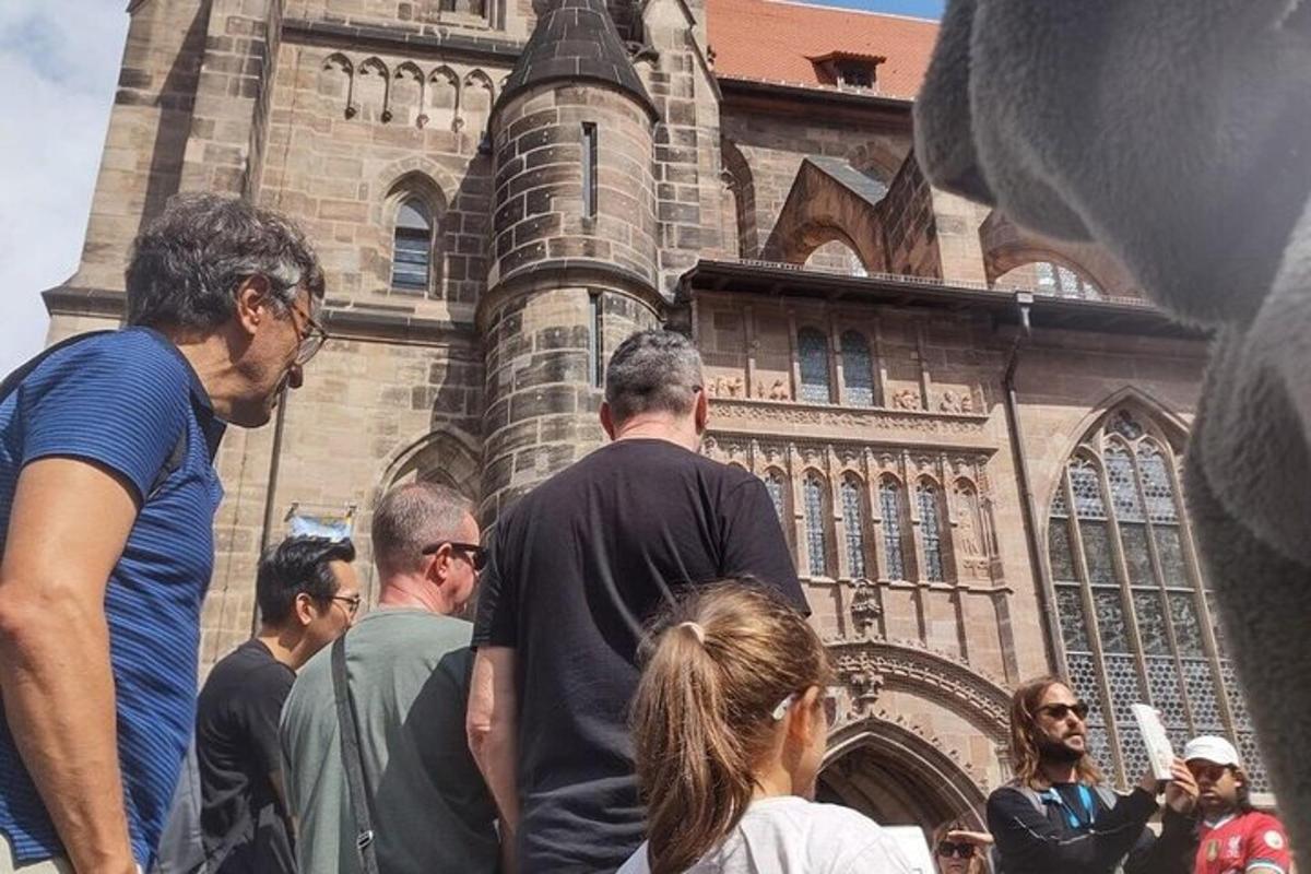 a group of people standing in front of a church