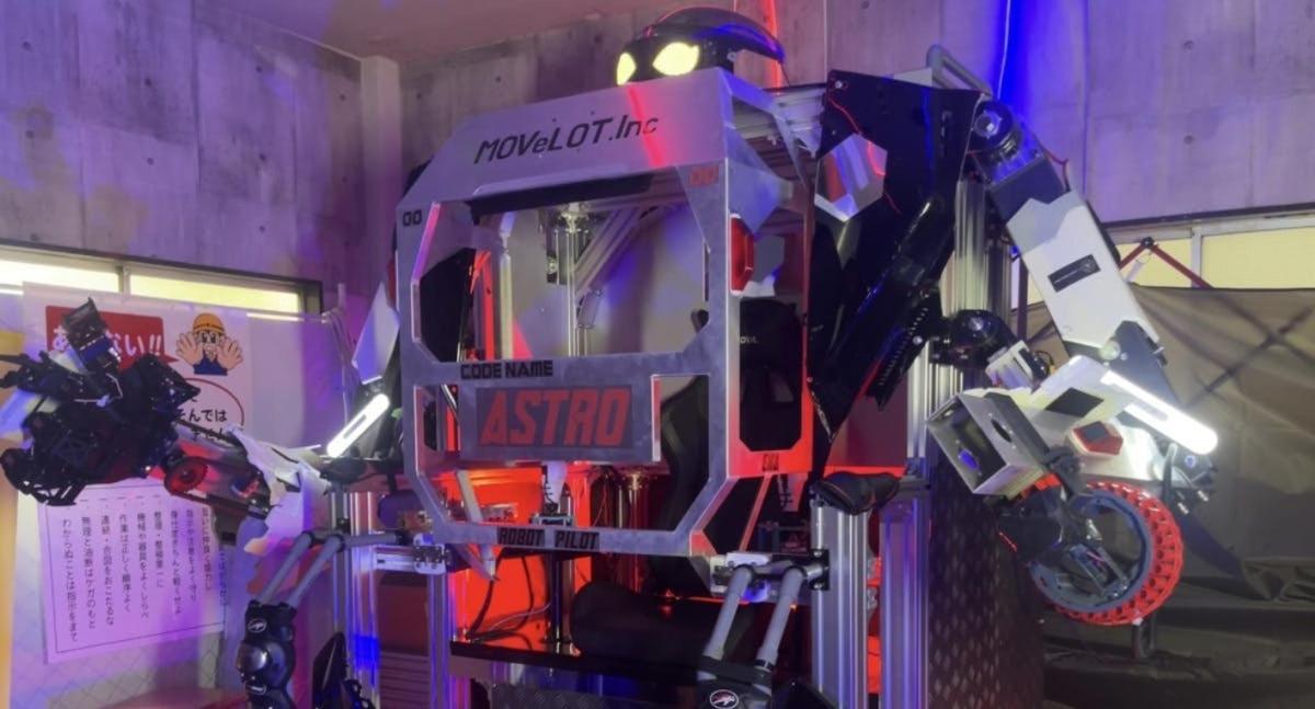a robot standing next to a motorcycle in a garage