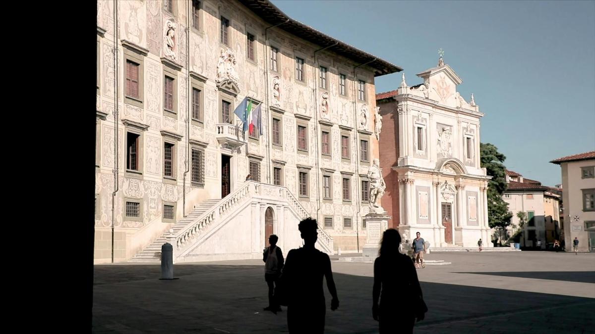 a group of people standing in front of a building
