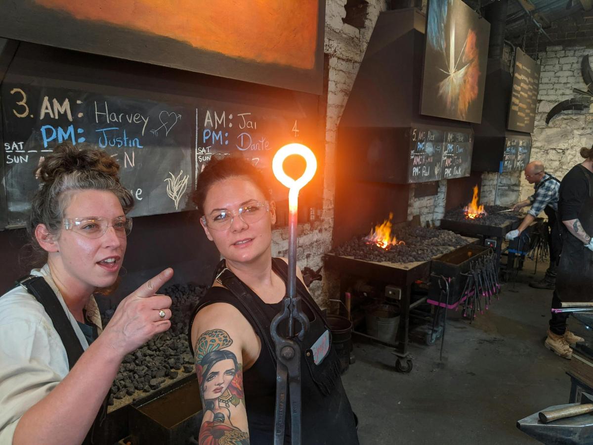 a woman standing next to a man in a bar