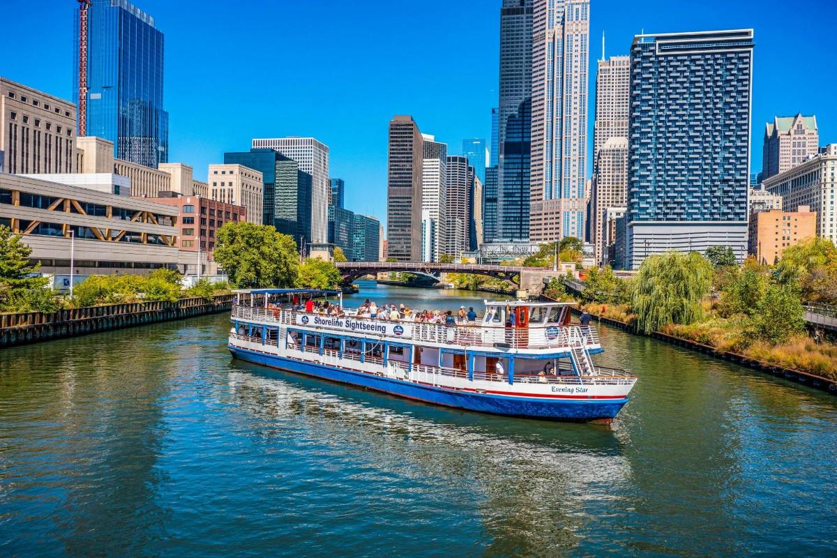 a boat traveling down a river in a city