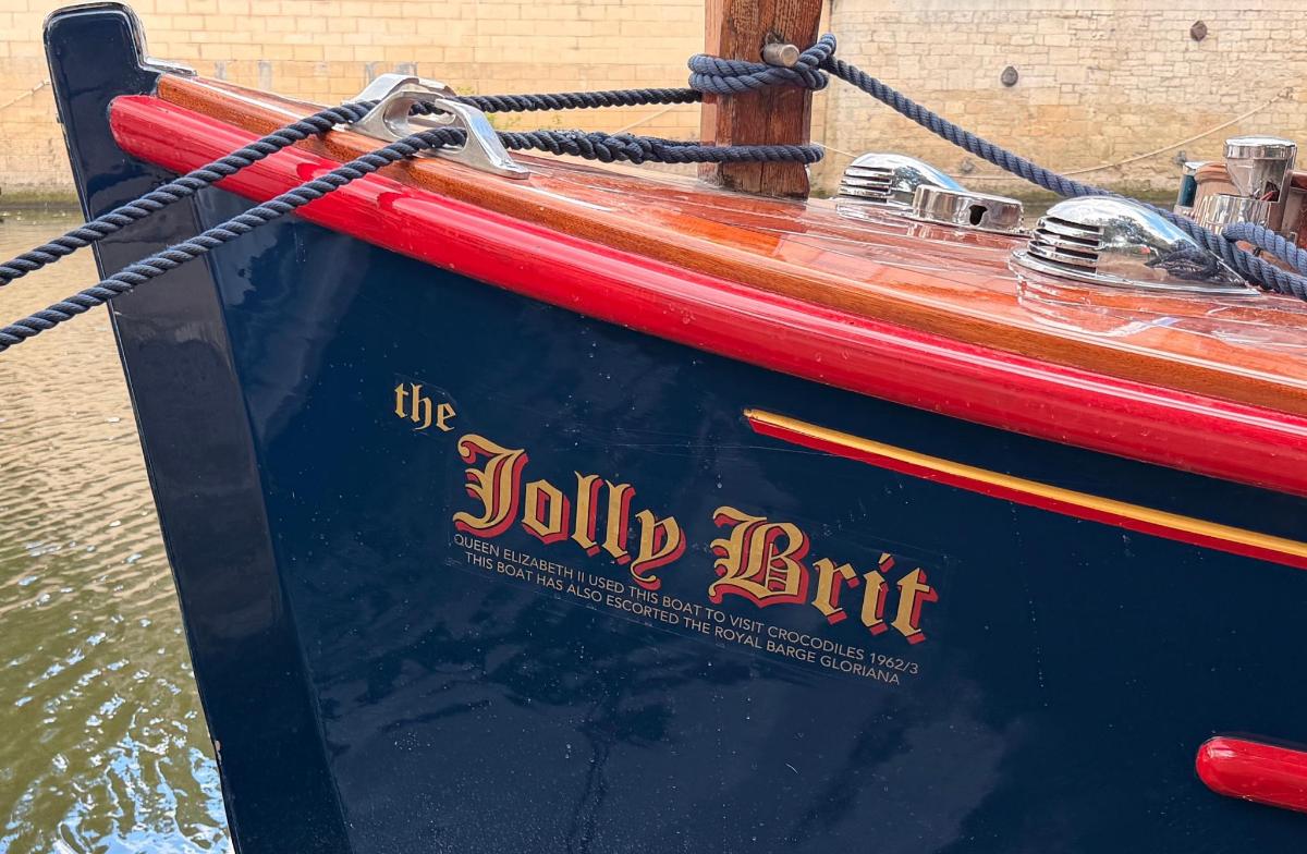 a boat with a sign on the side of it