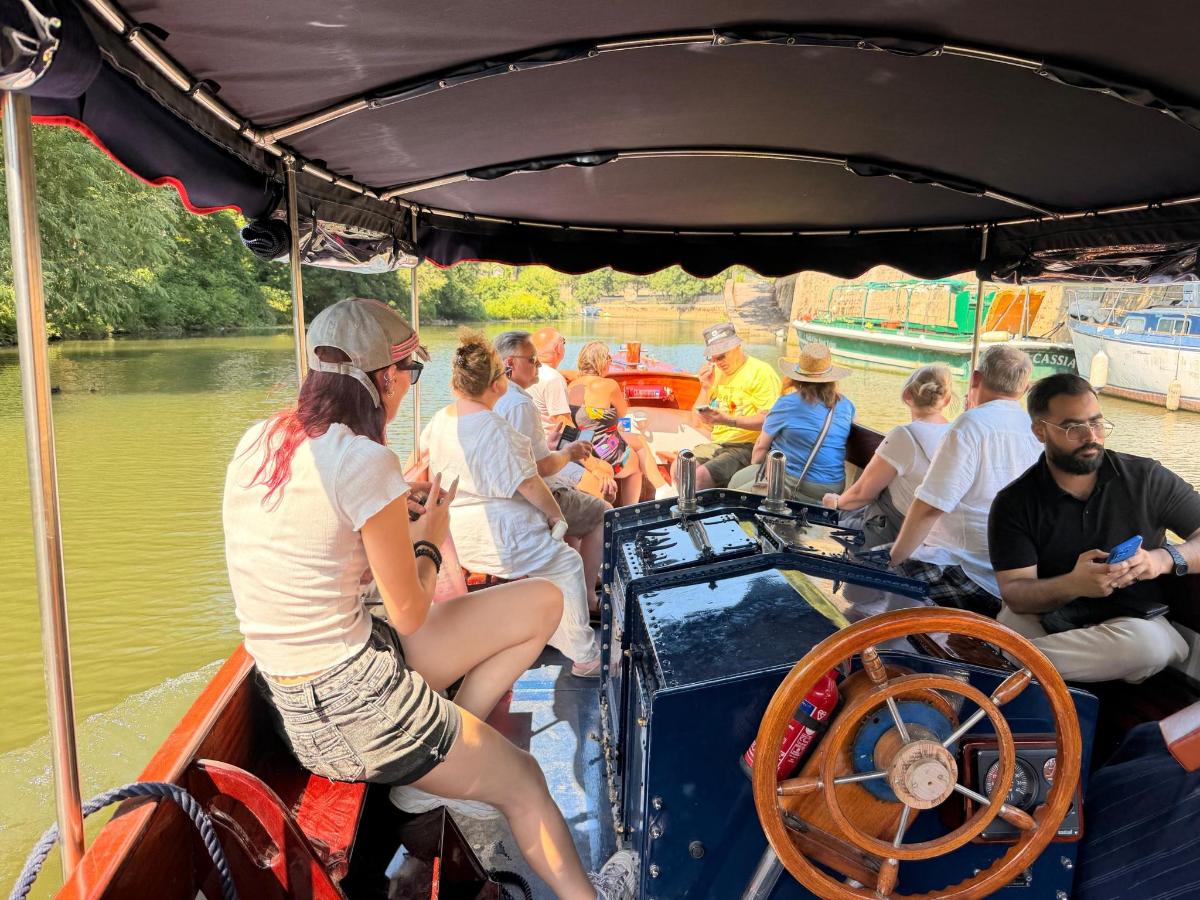 a group of people on a boat in the water