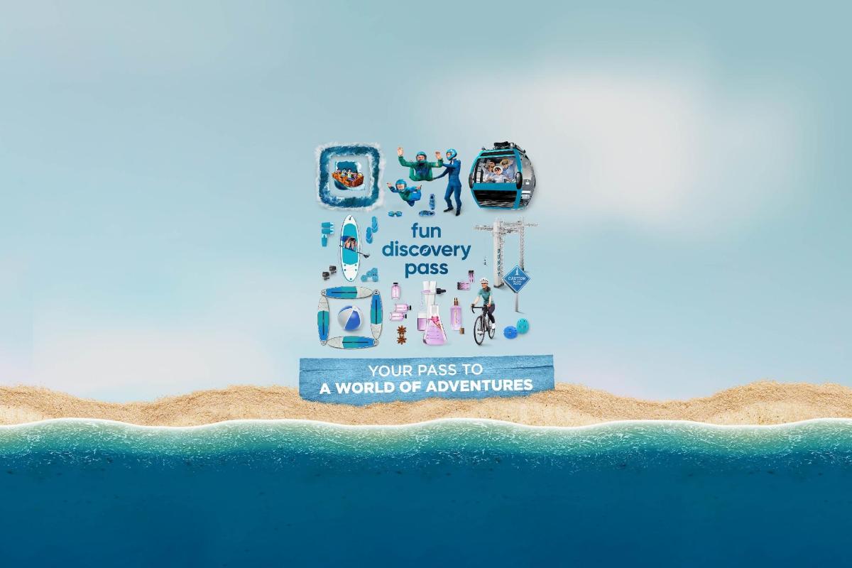 a sign on top of a beach with the ocean