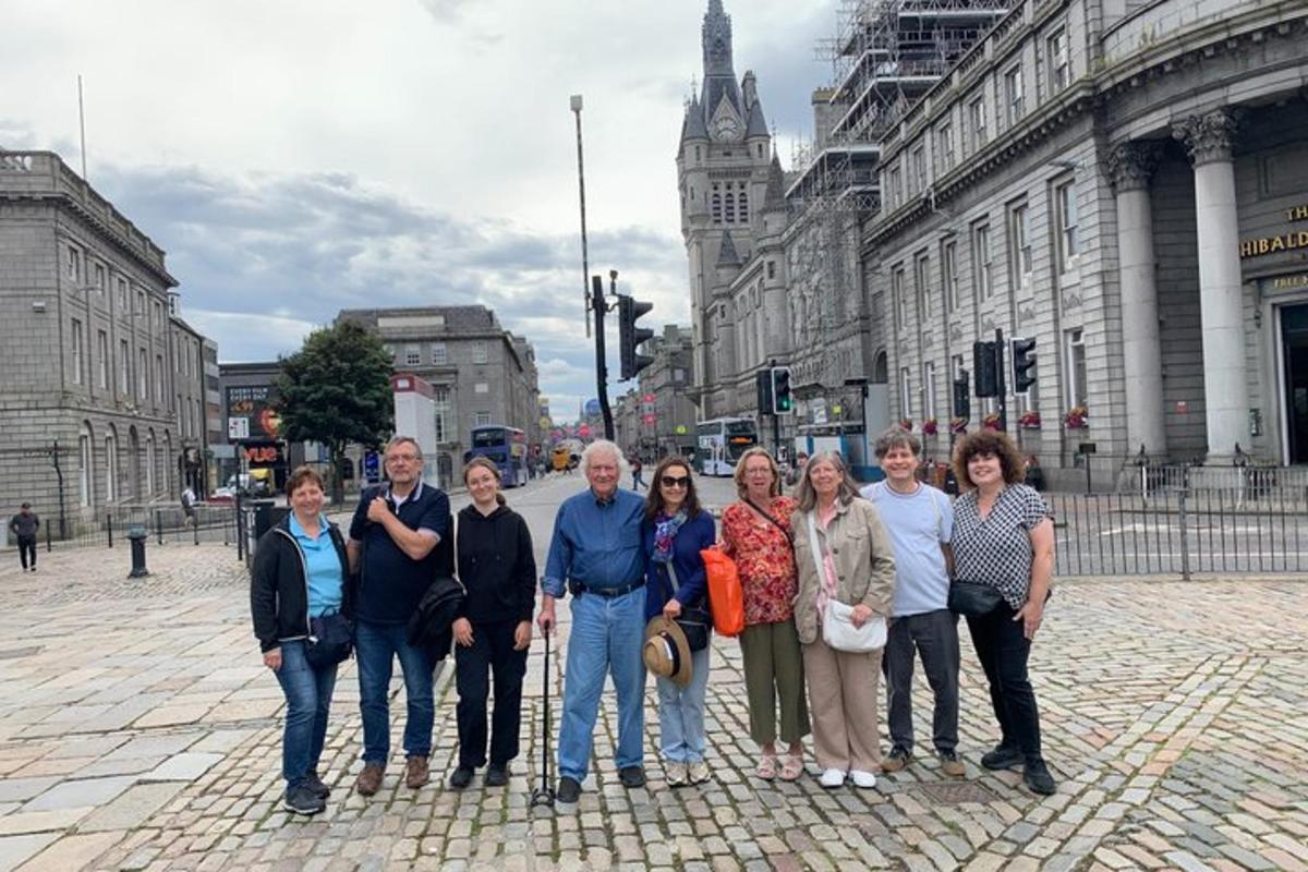 a group of people standing in front of a city