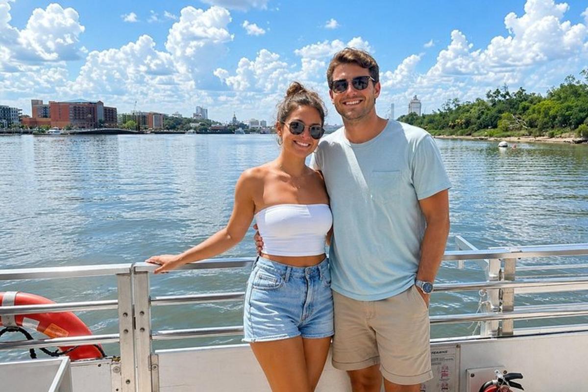 a man and a woman standing on a boat
