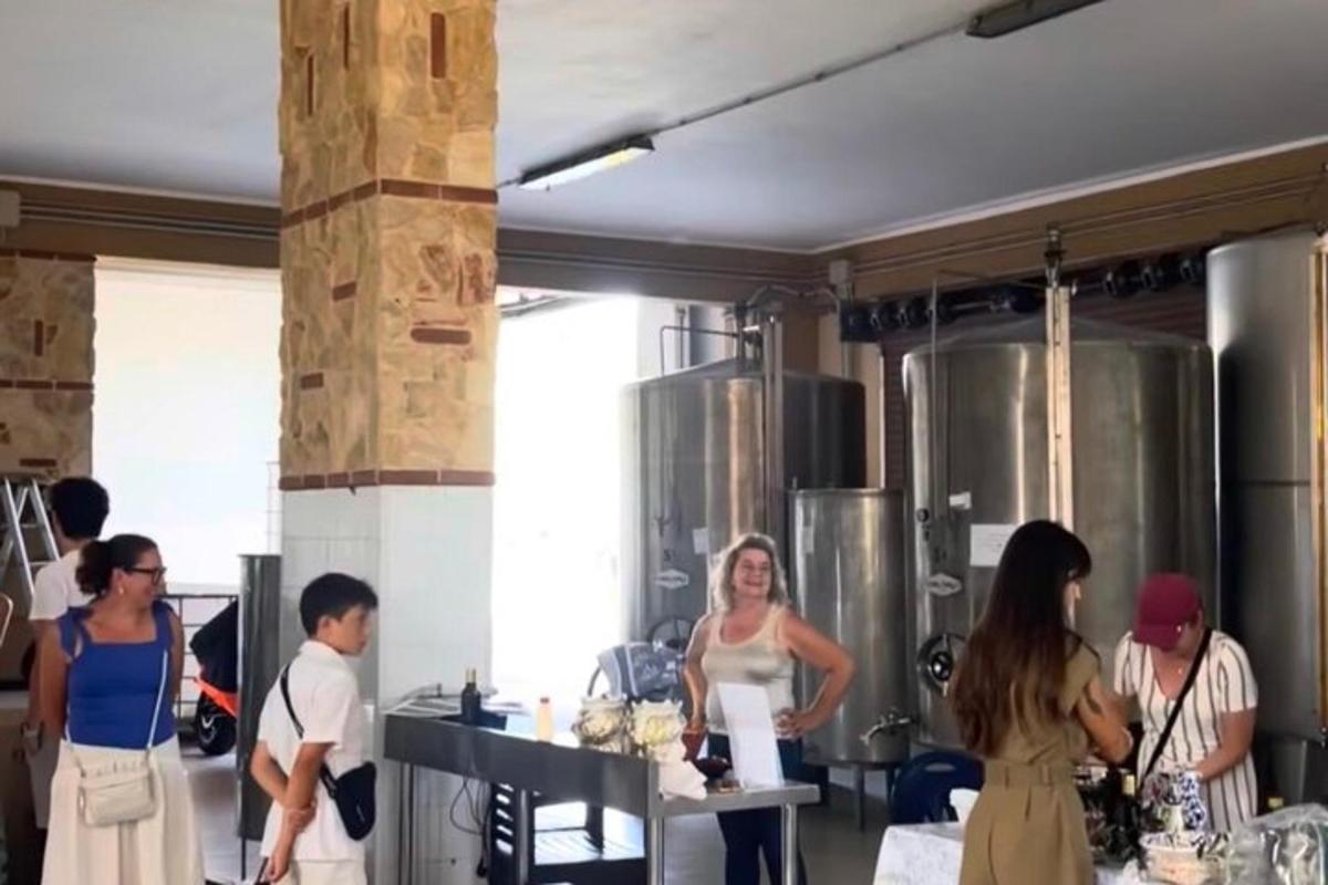 a group of people standing in a kitchen