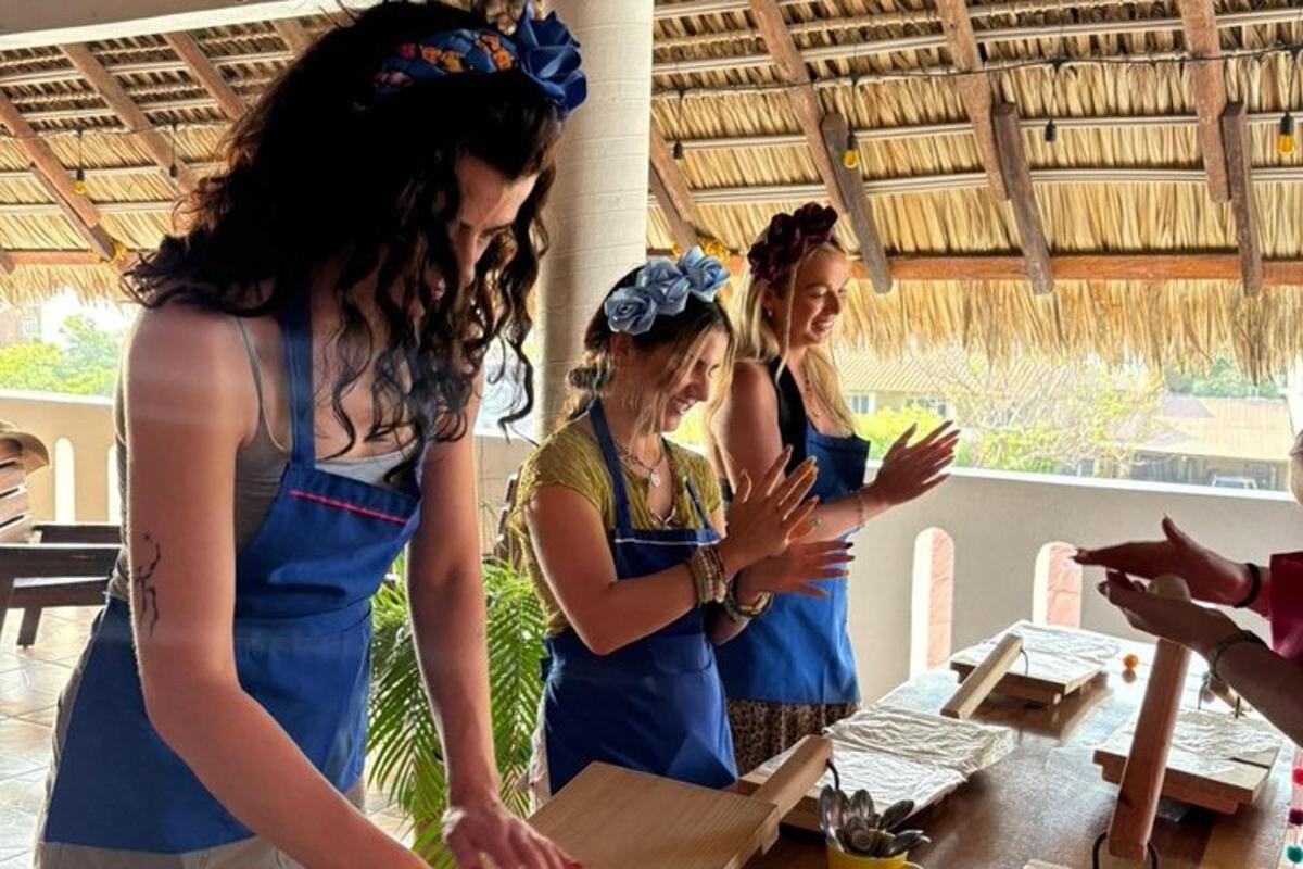 a group of women in blue uniforms standing around a table