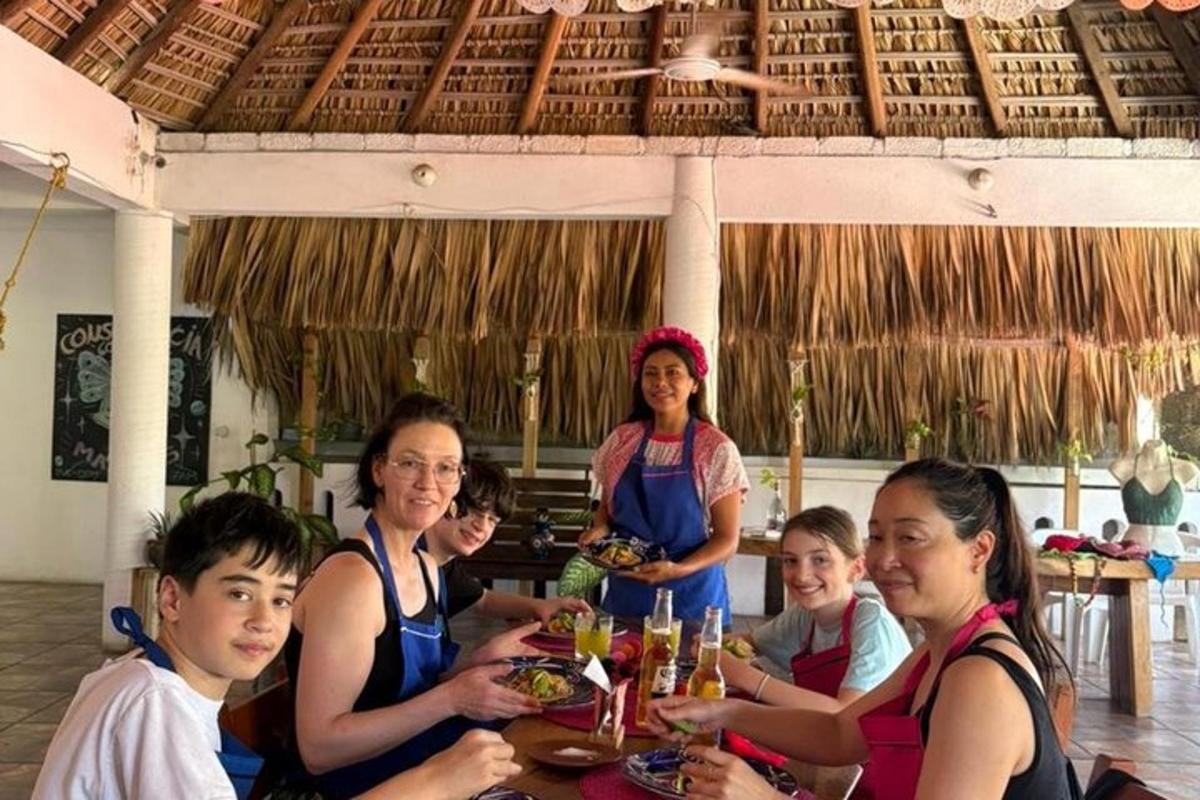 a group of people sitting at a table eating food