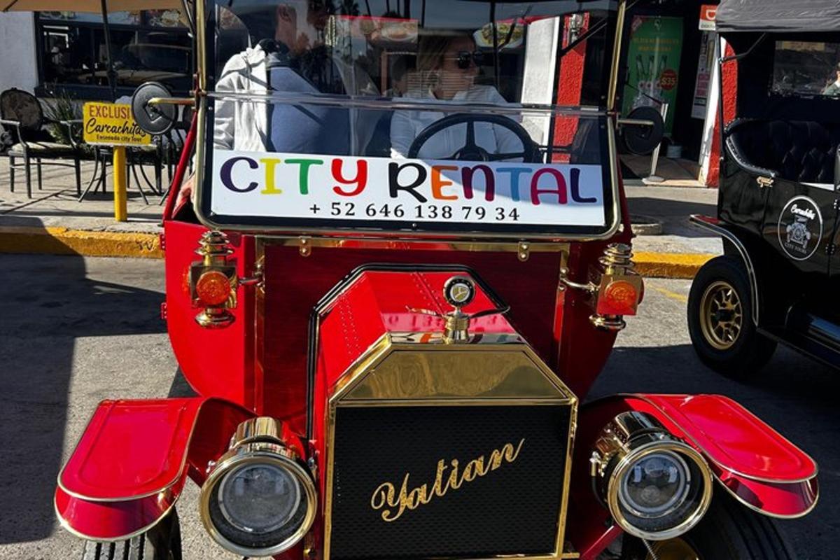 a red car with a sign on the front