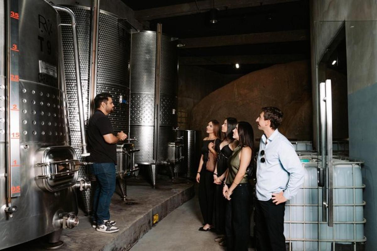 a group of people standing outside of a brewery