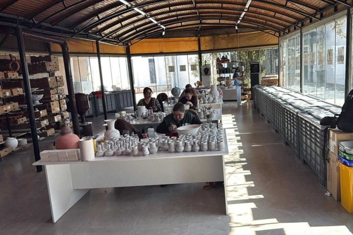 a group of people sitting at a table in a store