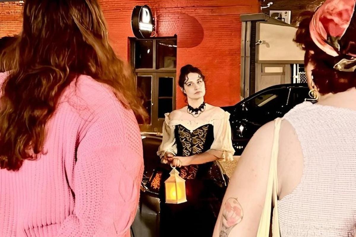 a woman standing in front of a car in a salon