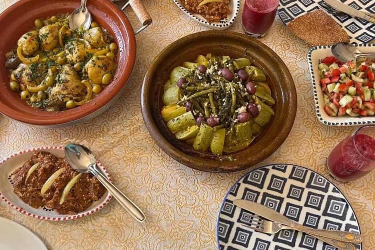 a table with bowls of food and plates of food