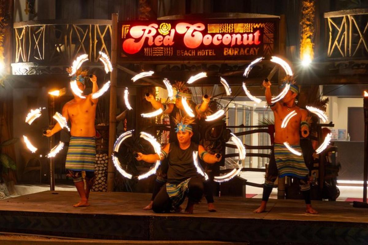 a group of performers on a stage with sparklers