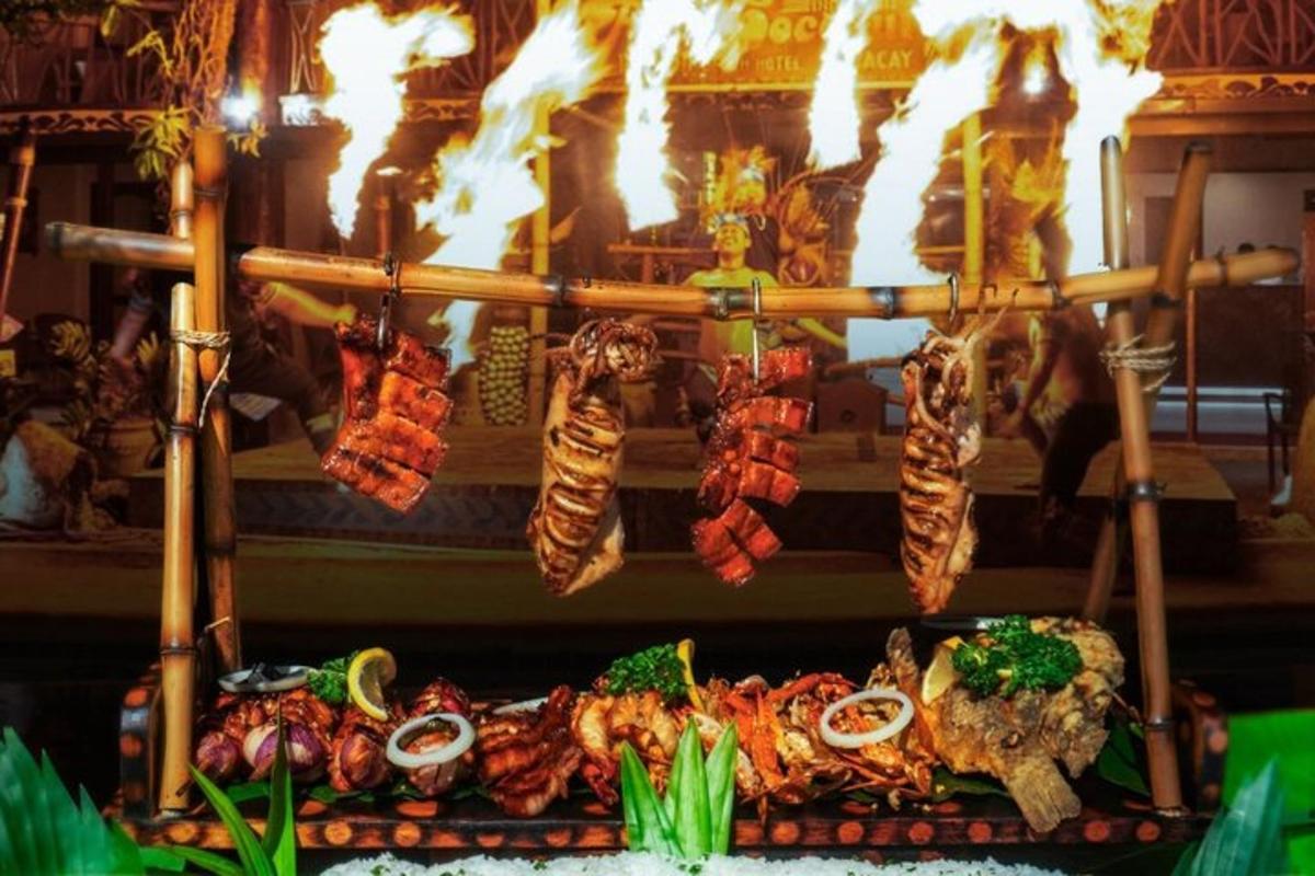a display of food on a table with fire