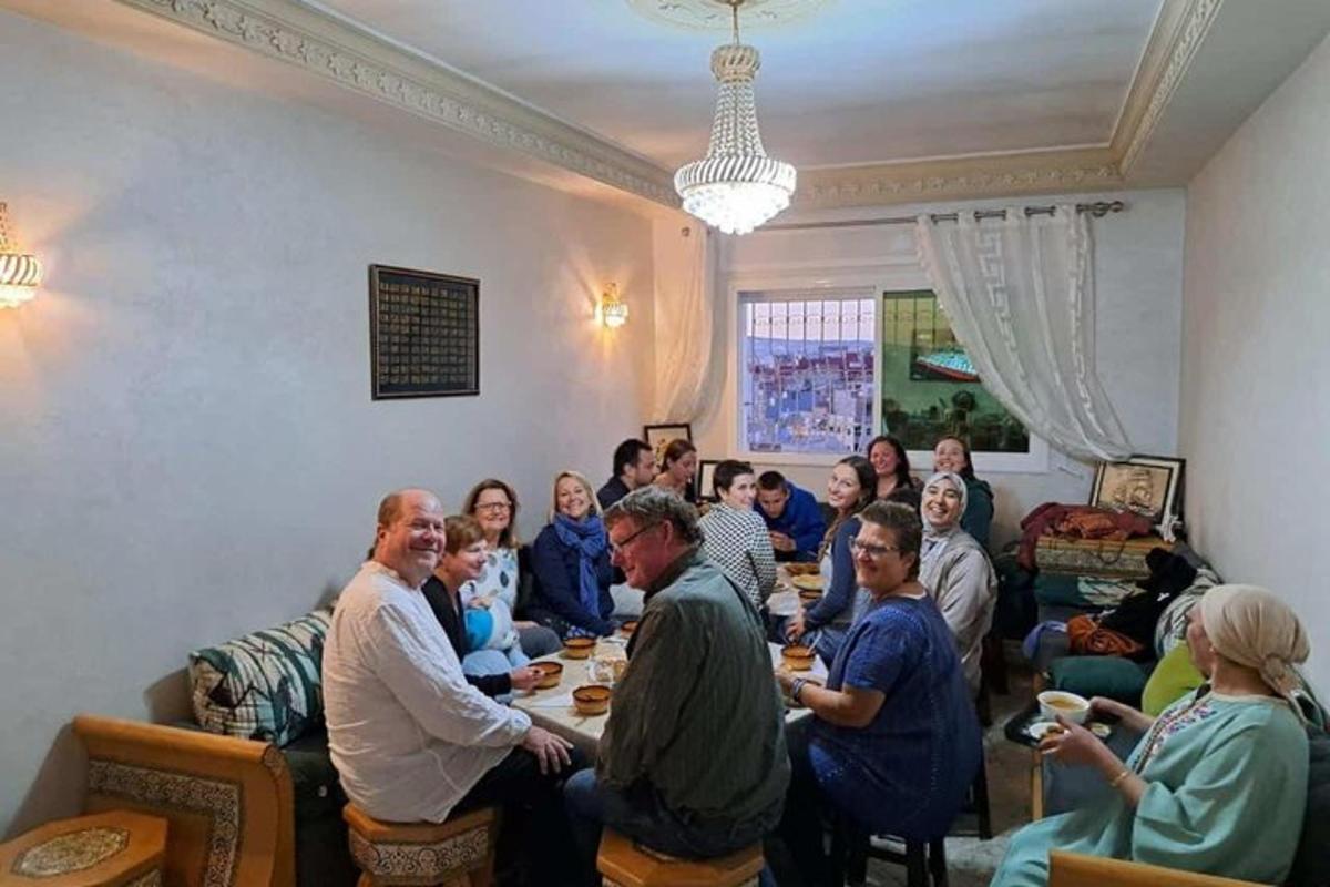 a group of people sitting around a table in a room