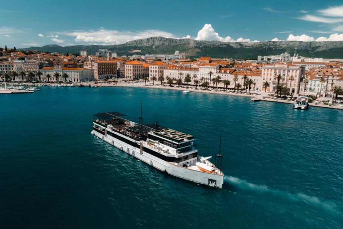 a boat in the water with a city in the background