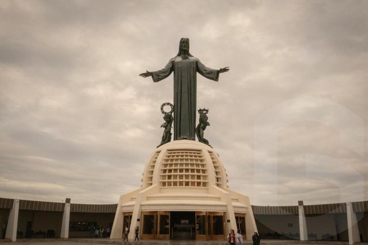 a large statue of christ the redeemer on top of a building
