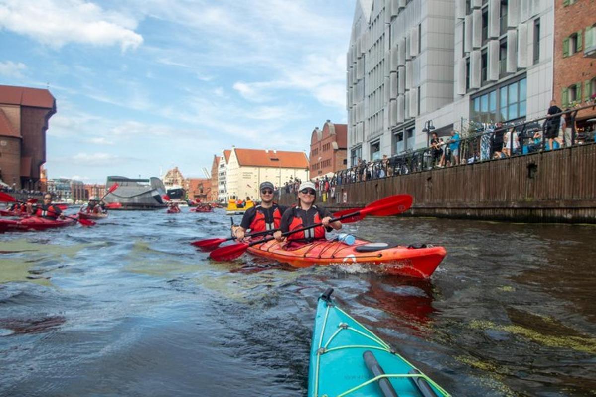 two people are in kayaks on a river