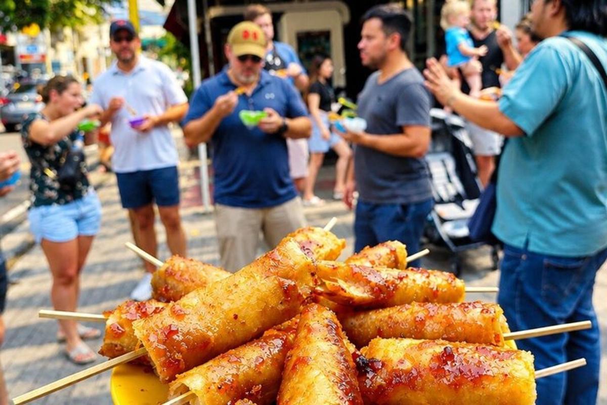 a group of people standing around a table with food