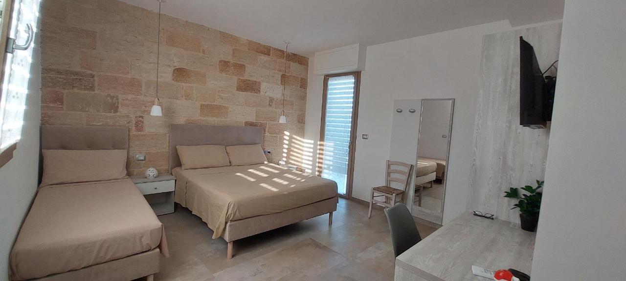 Letto o letti in una camera di Aurosa Vacanze