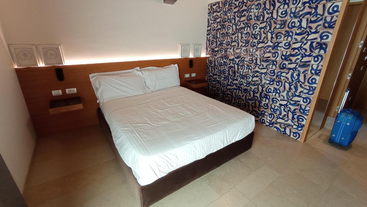 Letto o letti in una camera di Borgo Giallonardo Wine Relais