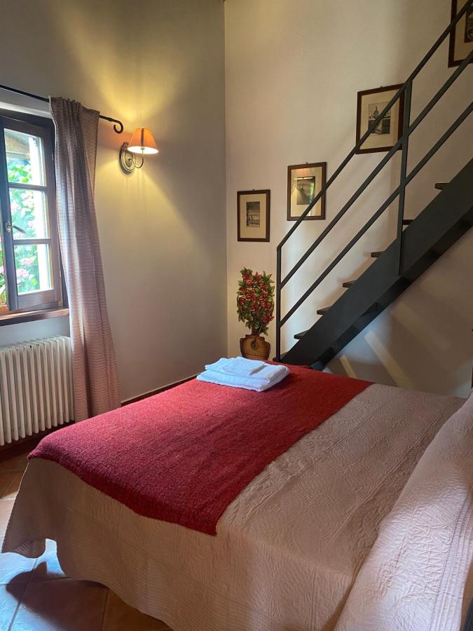 Letto o letti in una camera di Agriturismo Cà Di Rossi