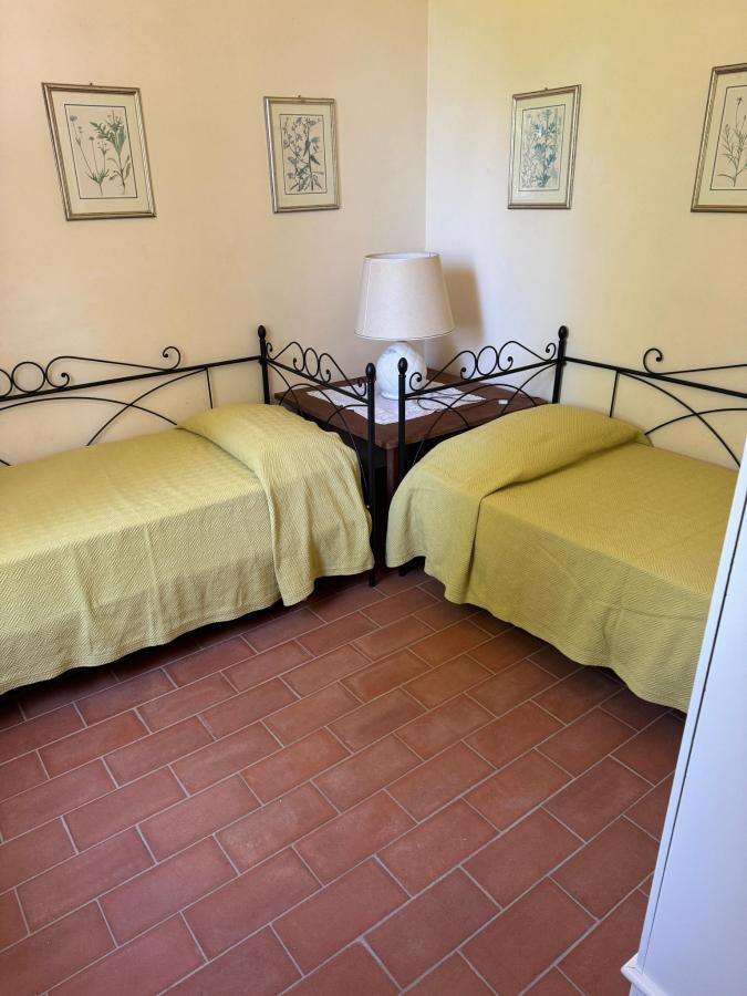 Letto o letti in una camera di Villa Buonaparte