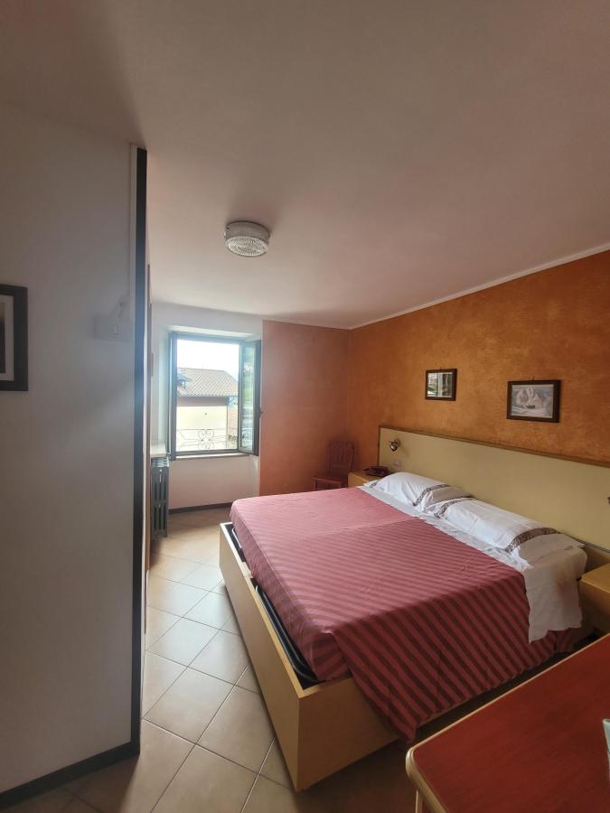 Letto o letti in una camera di Hotel Carrara