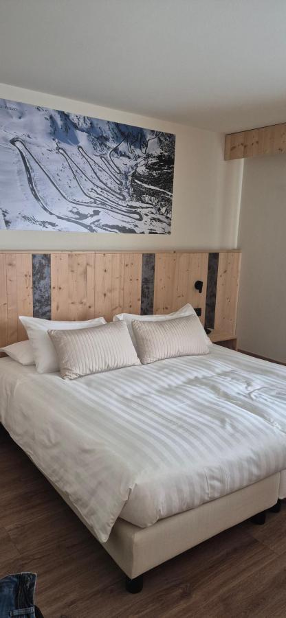 Letto o letti in una camera di Palace Hotel Wellness & Beauty