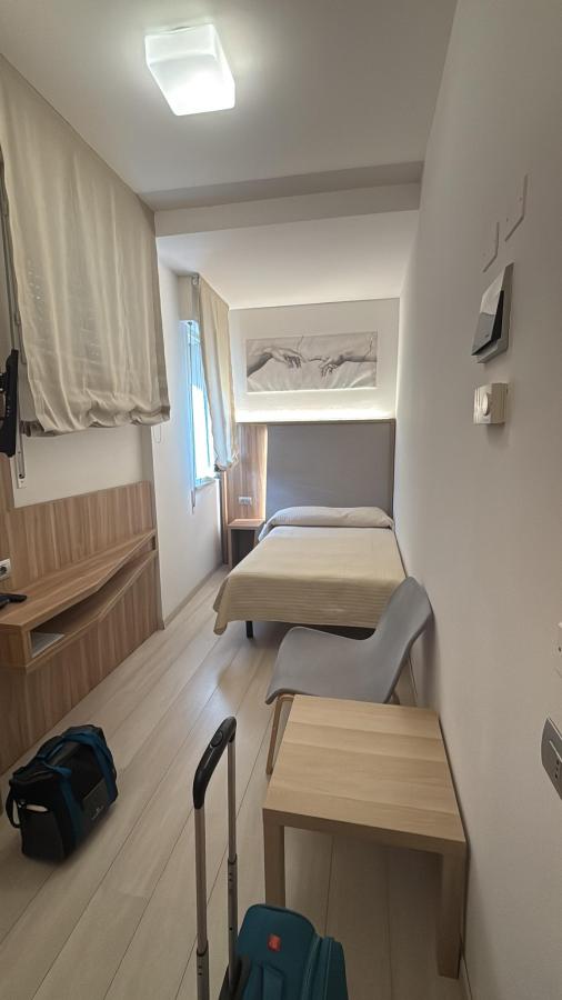 Letto o letti in una camera di Hotel Ricchi