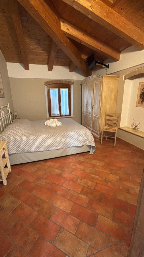 Letto o letti in una camera di Agriturismo Corte Albarel