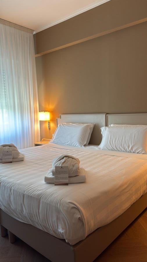 Letto o letti in una camera di Silva Hotel Splendid