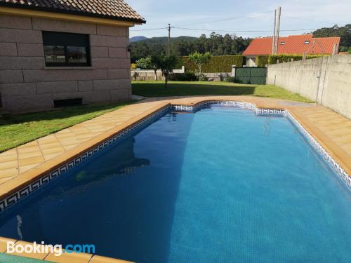 Swimming pool and wifi home in Tomiño convenient for families.