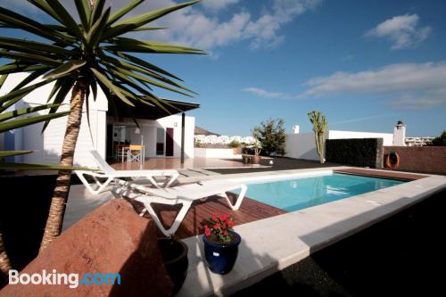 Swimming pool and air-con home with internet and terrace.