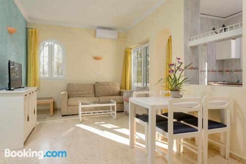 Cot available apartment in Denia with terrace and swimming pool.