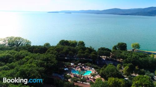 Child friendly apartment in Monte del Lago with terrace and internet