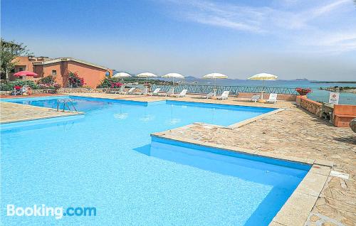 1 bedroom apartment home in Marinella with pool.